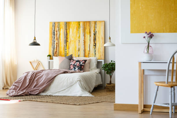 istock Energetic bedroom with yellow artwork 840831950
