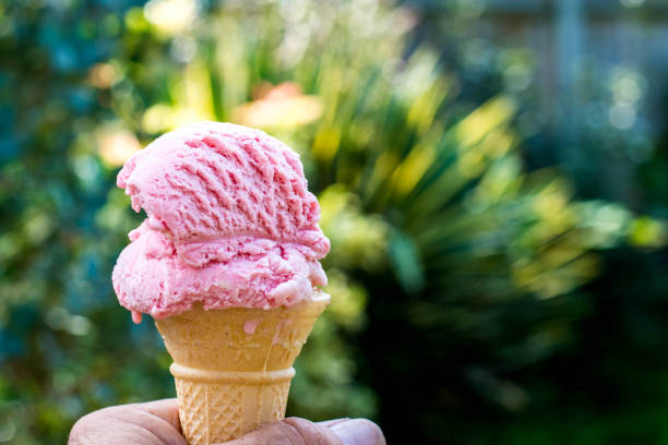 Holding a Strawberry Ice Cream Cone
