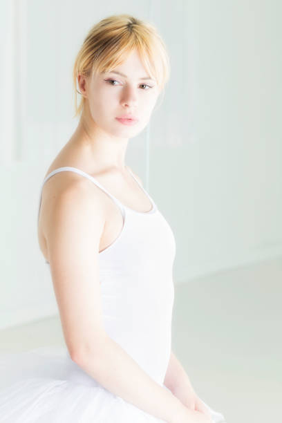 Close-up of a blonde, brown-eyed ballet dancer in her early 20s.