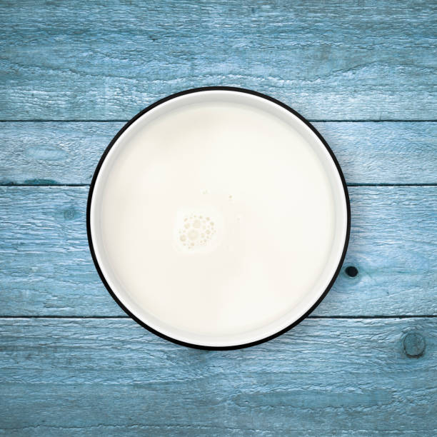 istock Milk bowl on blue wood background from directly above. Clipping path. 840846018