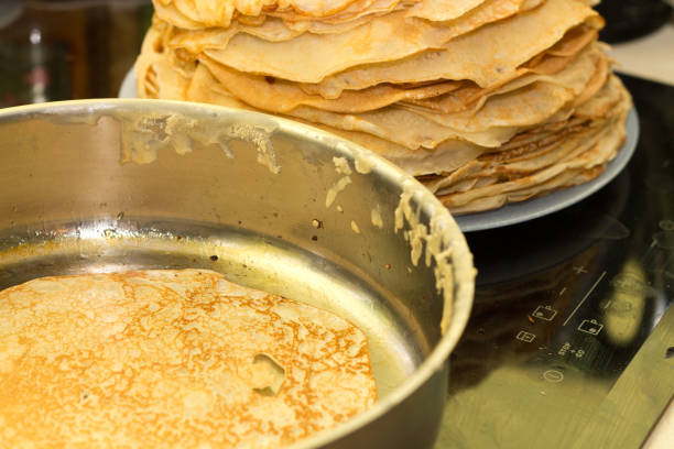 istock Baking pancakes. Pancakes are fried on a hot frying pan 840846184
