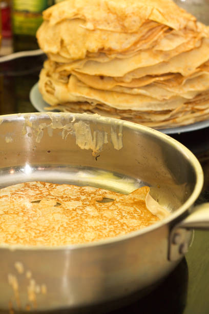 istock Baking pancakes. Pancakes are fried on a hot frying pan 840846458