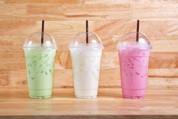istock Colorful milk beverages on wood background 840850058