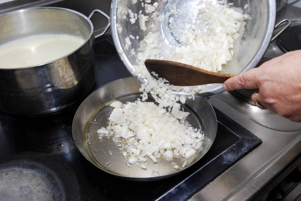 istock Fresh onions frying in the pan. Cooking concept. 840851020