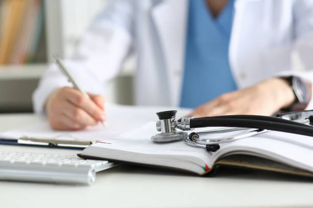 istock Stethoscope head lying on medical forms closeup 840851424