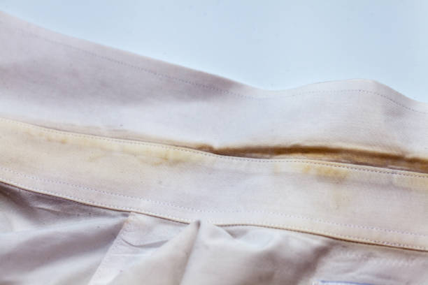 istock Yellow collar stain on white dirty shirt 840853876