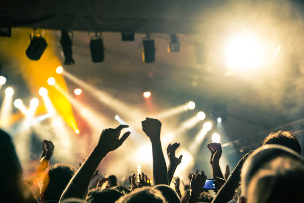 istock Concert crowd in front of stage lights 840854664