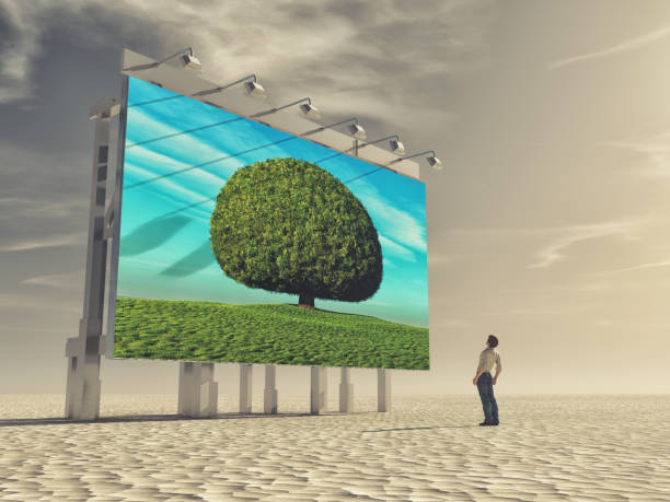 istock A young man looks at a billboard 840855290
