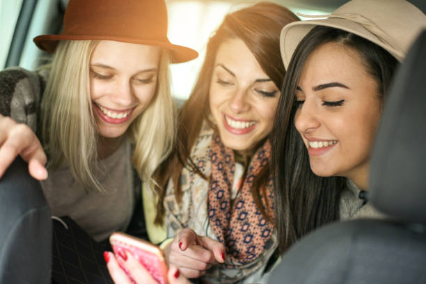 istock Three best friends sitting in the car. 840855362