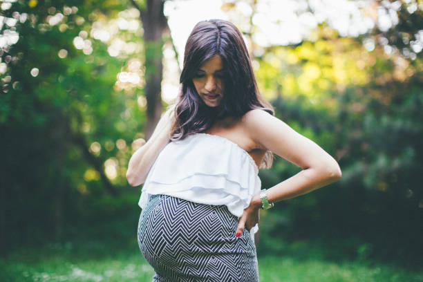 istock Pregnant woman standing 840858488