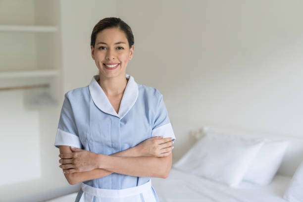 istock Happy housekeeper working at a hotel 840862618