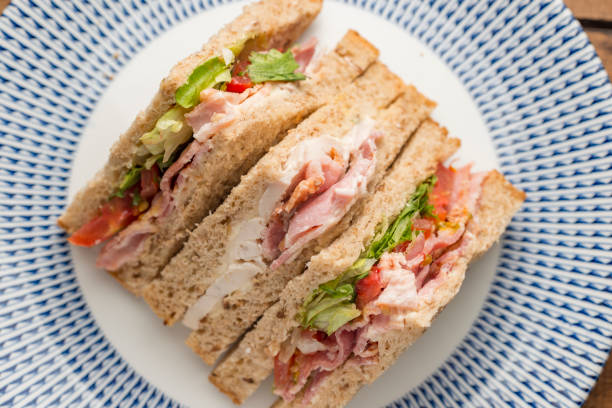 istock BLT and chicken sandwich on a plate from above. 840870798