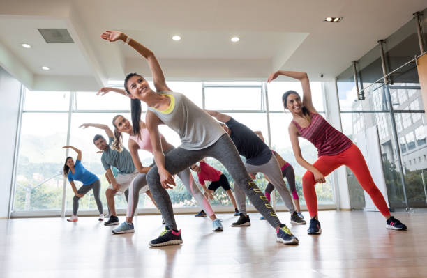 istock People at the gym stretching in an aerobics class 840874668