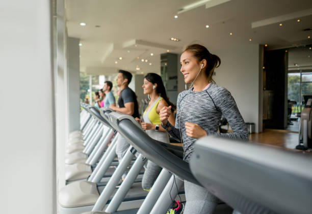 istock People running at the gym on the treadmill 840874742