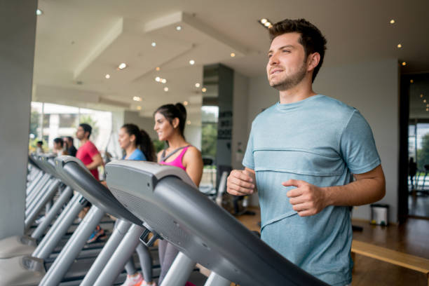 istock Man exercising at the gym on the treadmill 840874756
