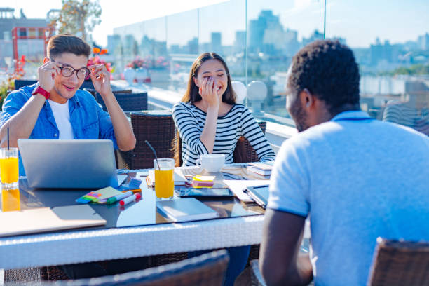 istock Cheerful freelancers joking during informal meeting 840878678
