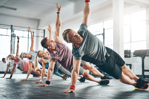 Shot of a fitness group working out at the gym