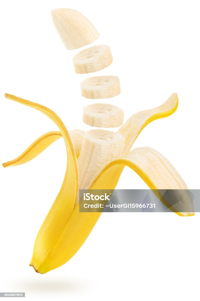 sliced banana floating on white background open and sliced banana floating isolated on white background Banana Stock Photo