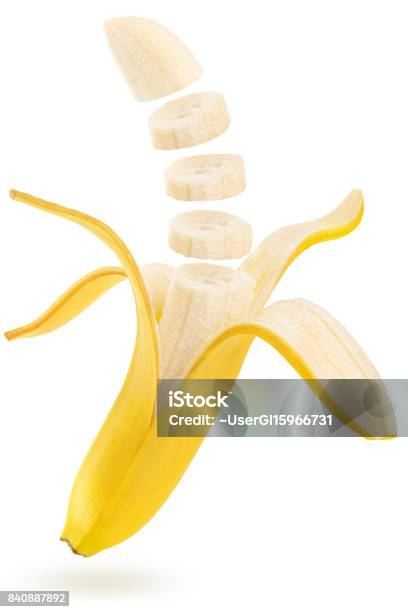 Sliced Banana Floating On White Background Stock Photo - Download Image Now - Banana, Cut Out, Slice of Food