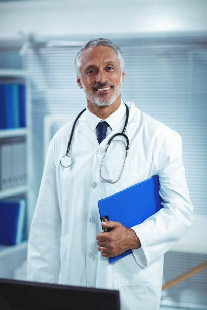 istock Happy doctor holding clipboard 840891742