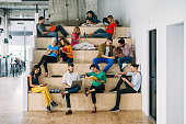 Large group of people networking in a loft office