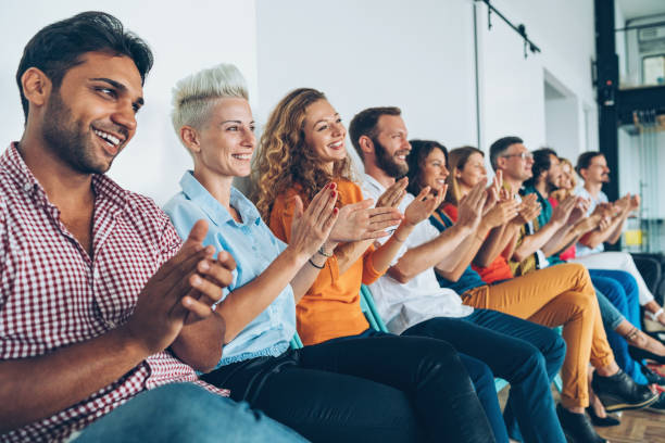 istock Large group of people applauding 840894220