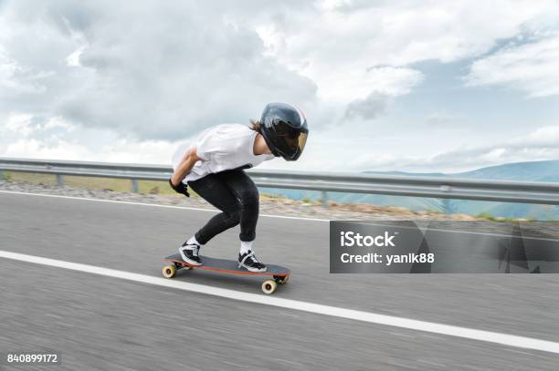 A Young Guy In A Fullface Helmet Is Riding On A Country Road At High Speed In The Rain Stock Photo - Download Image Now