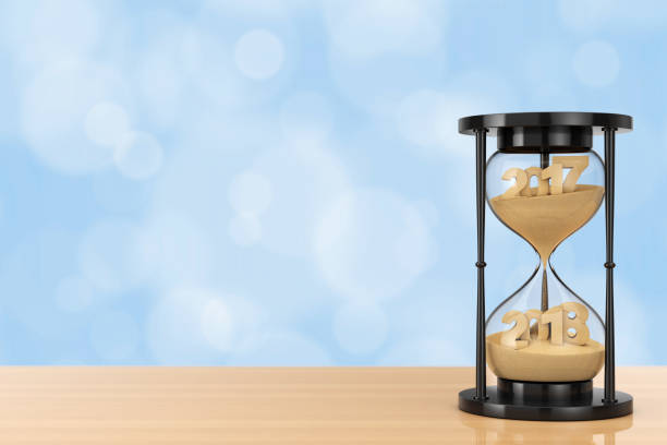 istock New 2018 Year Concept. Sand Falling in Hourglass Taking the Shape from 2017 to 2018. 3d Rendering 840904684