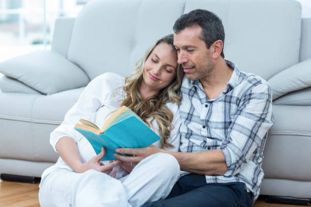 istock Expecting couple sitting on floor 840904928
