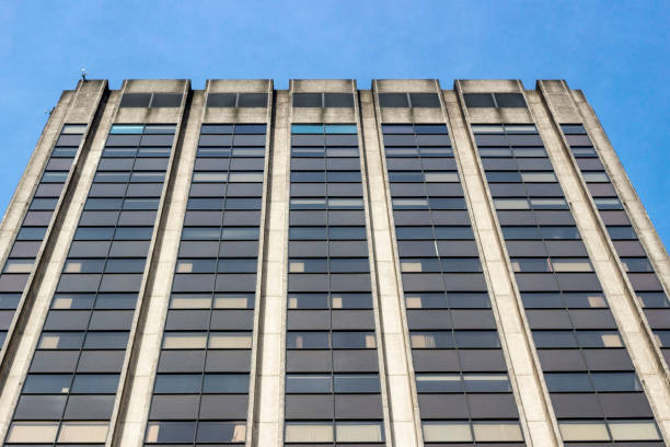 istock Looking up at a concrete office building 840914158
