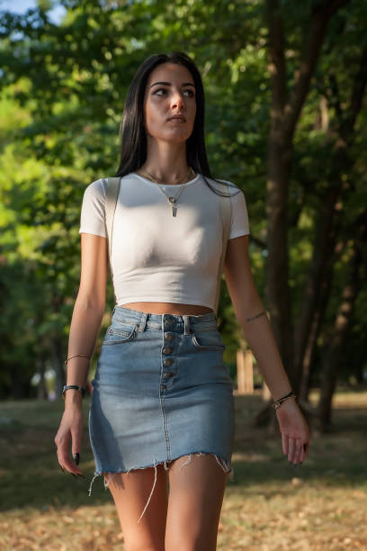 istock Girl walking in a park 840918608