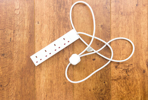 White UK power extension lead with multiple sockets stock photo