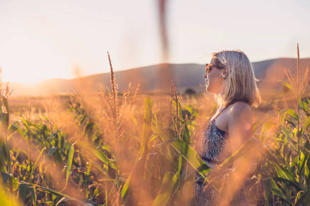istock Young blonde woman in corn field 840919840