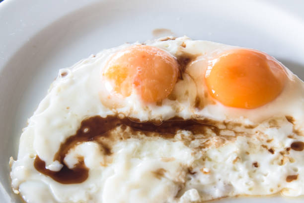 istock Two fried eggs for healthy breakfast food concept 840920152