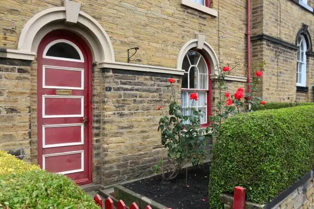Saltaire - Victorian model village in Shipley (England) listed as UNESCO World Heritage Site. Old door.