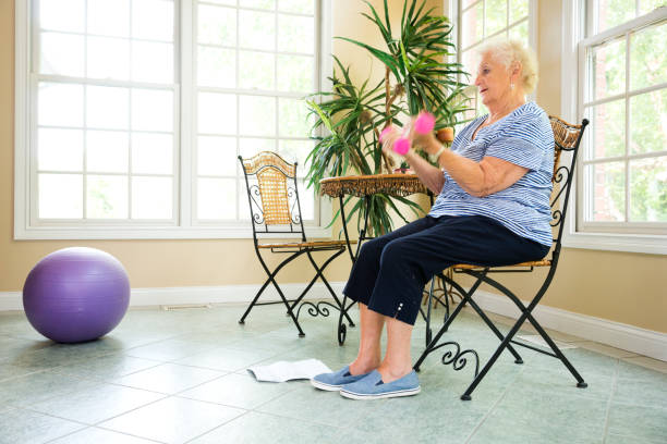 istock Senior doing physical therapy exercises at home 840923800