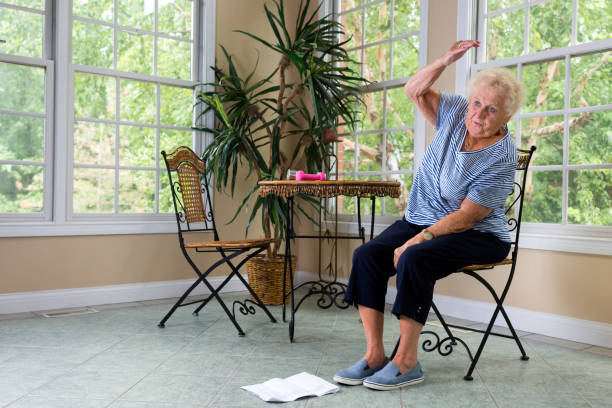 istock Senior doing physical therapy exercises at home 840923840