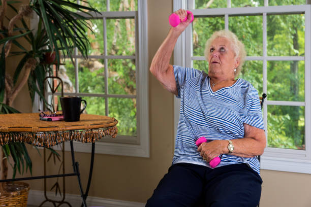 istock Senior doing physical therapy exercises at home 840923912