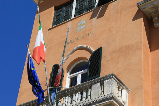 Facade of the Monterosso City Council with flags