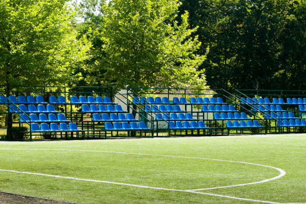 istock football field with bleachers 840927396