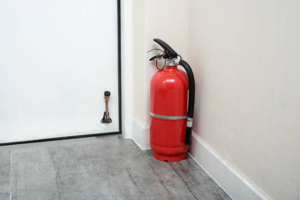 Fire extinguishers in home door. stock photo