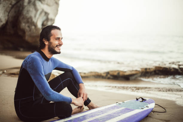 istock Surfer man relaxing after surfing 840927656