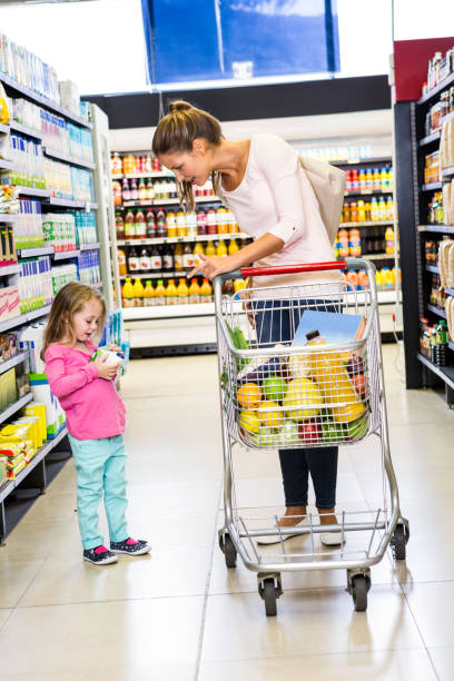 istock Mother and daughter doing shopping 840927952