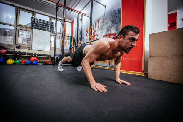 istock Bodybuilder doing push-ups in the gym 840931080