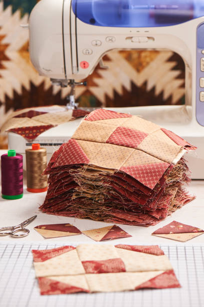 istock Quilt blocks sewing with an electric sewing machine, pile ready blocks 840939610