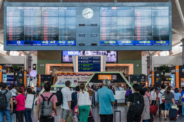 Departure Board in KL International Airport. Departure Hall Malaysia Kuala Lumpur: Departure Board in Kuala Lumpur International Airport 2, AKA KLIA2 in Malaysia capital has 2 Departure Hall one called KLIA and KLIA2 kuala lumpur airport stock pictures, royalty-free photos & images