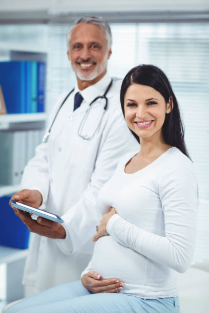 istock Pregnant woman interacting with doctor 840942678