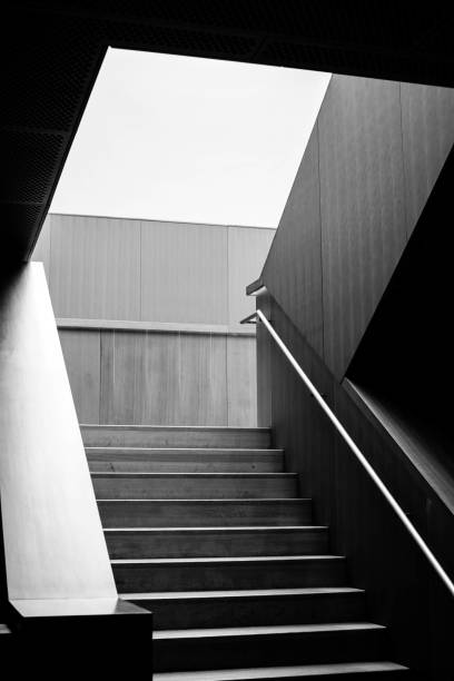 istock black and white image of a staircase casted in shadow and light 840942740