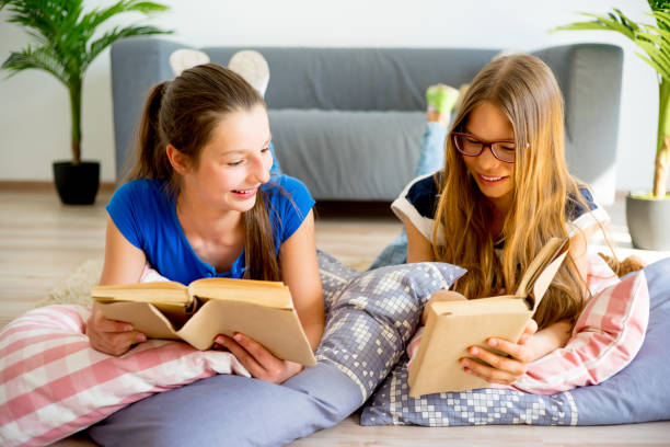 istock Two girl studying at home 840947130