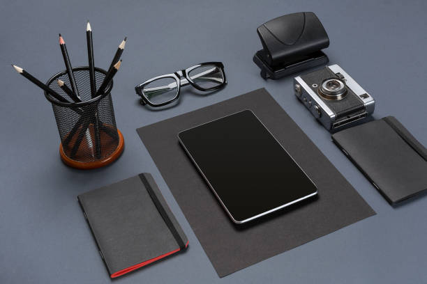 istock Black office stuff collection flat lay. Top view on set of stationery with tablet 840947390